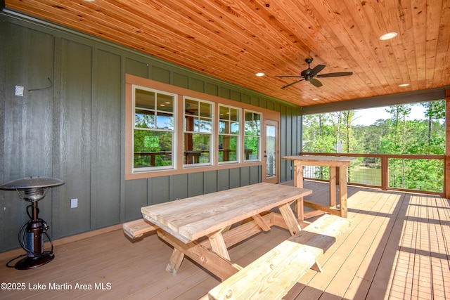 wooden deck featuring a ceiling fan
