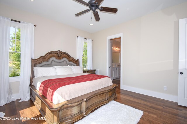 bedroom featuring baseboards, multiple windows, recessed lighting, and wood finished floors