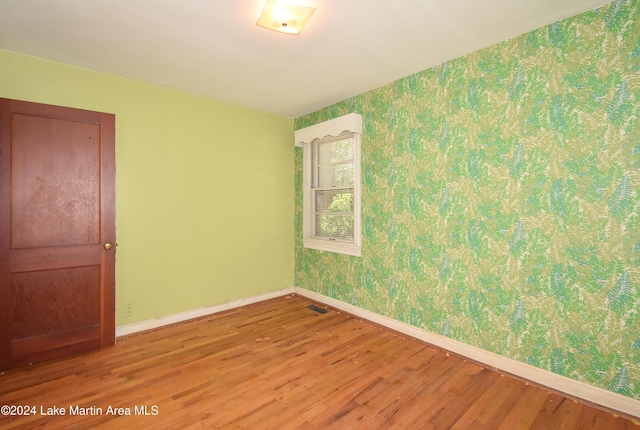 empty room with wood-type flooring