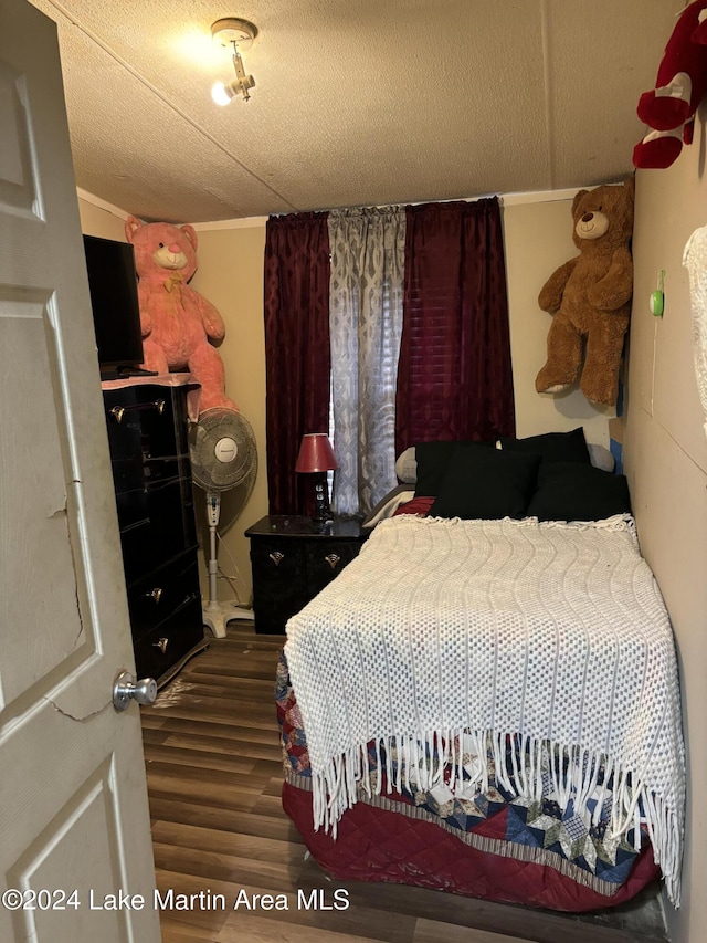 bedroom featuring dark hardwood / wood-style floors