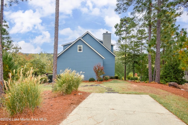 view of home's exterior with a lawn