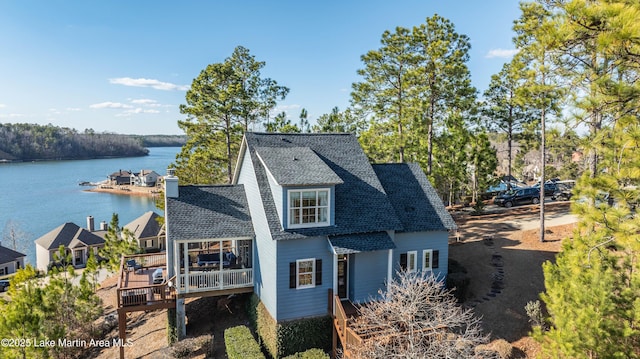 view of front of property with a water view