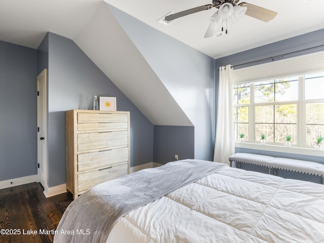 bedroom with lofted ceiling, radiator, dark wood-type flooring, and ceiling fan