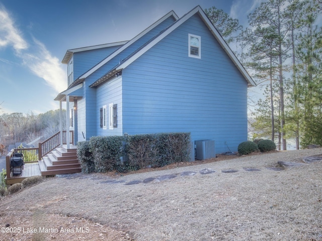 view of side of property with central AC