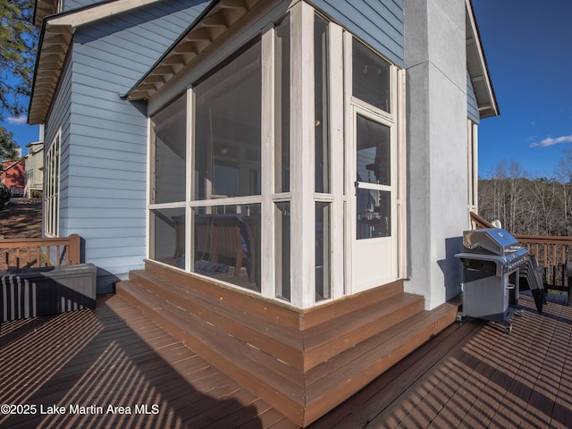 wooden terrace featuring grilling area