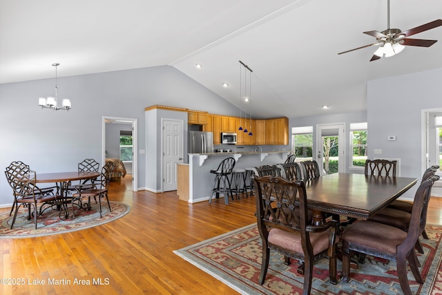 310 Hillwood, Dadeville, AL 36853 - dining area with a chandelier, light wood finished floors, a ceiling fan, and high vaulted ceiling
