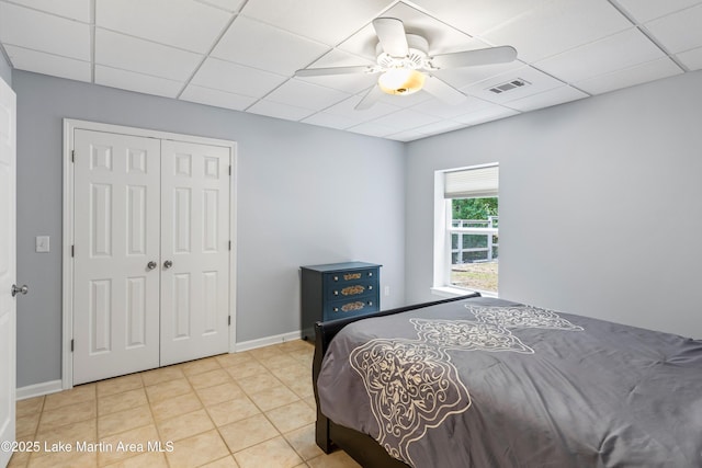 310 Hillwood, Dadeville, AL 36853 - bedroom featuring a drop ceiling, a closet, ceiling fan, and tile patterned floors