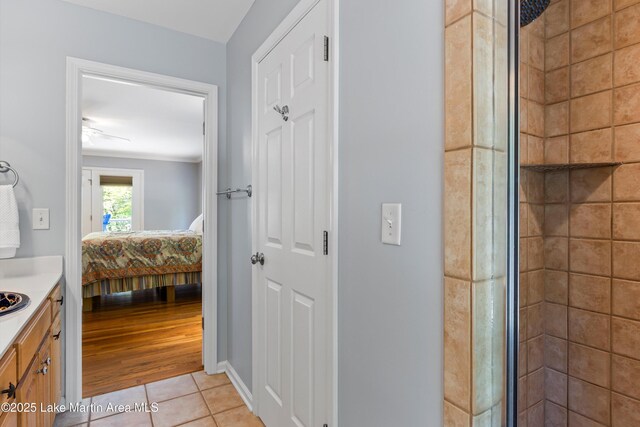 310 Hillwood, Dadeville, AL 36853 - ensuite bathroom featuring vanity, a tile shower, and tile patterned flooring