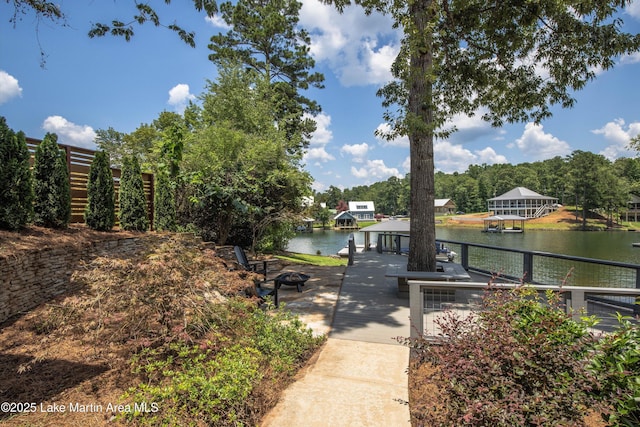310 Hillwood, Dadeville, AL 36853 - dock area featuring a water view, an outdoor fire pit, and view of scattered trees