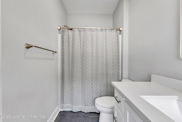 285 Magnolia Way, Dadeville, AL 36853 - bathroom with tile patterned floors, toilet, vanity, and curtained shower