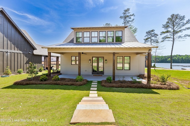 285 Magnolia Way, Dadeville, AL 36853 - view of front of property with ceiling fan, a front lawn, a water view, and metal roof