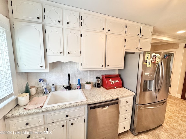 kitchen featuring white cabinetry, sink, and appliances with stainless steel finishes