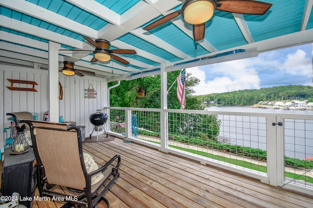 deck with a water view and grilling area