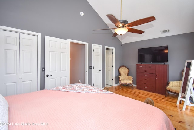 bedroom featuring ceiling fan, a closet, vaulted ceiling, and hardwood / wood-style flooring