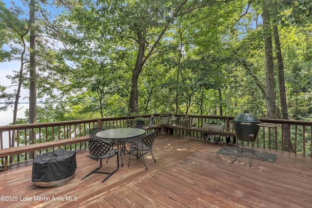 195 Honeysuckle Hl, Tallassee, AL 36078 - wooden deck featuring outdoor dining area