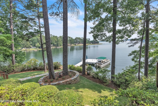 195 Honeysuckle Hl, Tallassee, AL 36078 - view of green lawn with a floating dock and a water view