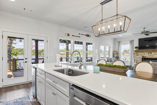 20 Heart Pine Ln, Dadeville, AL 36853 - kitchen with open floor plan, french doors, a ceiling fan, ornamental molding, and a fireplace