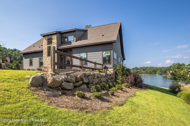 20 Heart Pine Ln, Dadeville, AL 36853 - rear view of house with a lawn, a water view, and a shingled roof