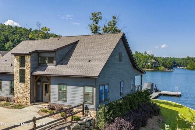 20 Heart Pine Ln, Dadeville, AL 36853 - view of front of home with roof with shingles, a floating dock, and a water view