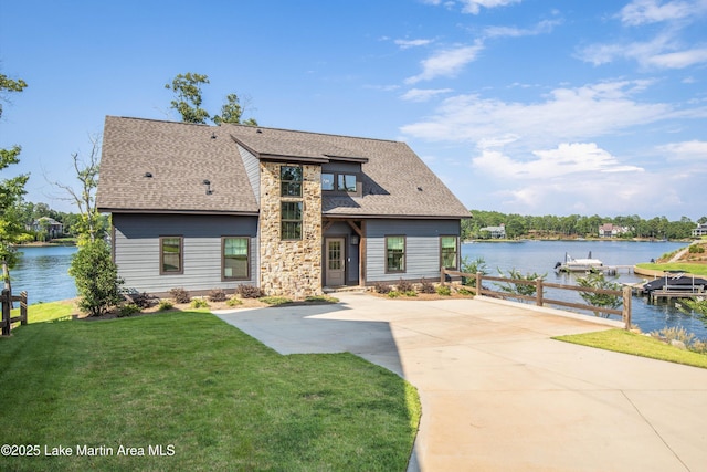 20 Heart Pine Ln, Dadeville, AL 36853 - view of front of property featuring stone siding, a front yard, a water view, and roof with shingles