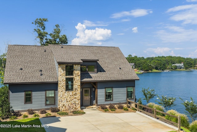20 Heart Pine Ln, Dadeville, AL 36853 - view of front facade with a water view, stone siding, and roof with shingles