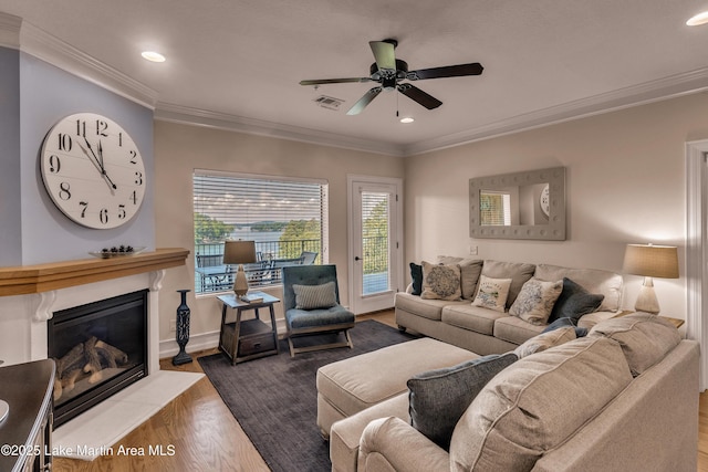 48 Stoneview Summit Ct Unit 2401, Dadeville, AL 36853 - living room with ceiling fan, a glass covered fireplace, wood finished floors, recessed lighting, and ornamental molding