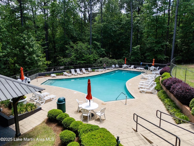 48 Stoneview Summit Ct Unit 2401, Dadeville, AL 36853 - community pool featuring fence, a patio area, and a wooded view