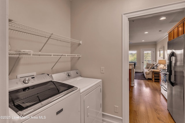 48 Stoneview Summit Ct Unit 2401, Dadeville, AL 36853 - clothes washing area with washing machine and clothes dryer, ornamental molding, light wood finished floors, baseboards, and recessed lighting