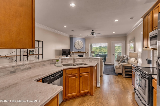 48 Stoneview Summit Ct Unit 2401, Dadeville, AL 36853 - kitchen with open floor plan, stainless steel appliances, a sink, a fireplace, and ceiling fan