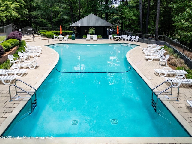 48 Stoneview Summit Ct Unit 2401, Dadeville, AL 36853 - community pool with a patio, fence, and view of scattered trees