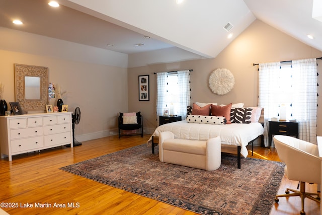 bedroom with light wood-style floors, recessed lighting, lofted ceiling, and visible vents