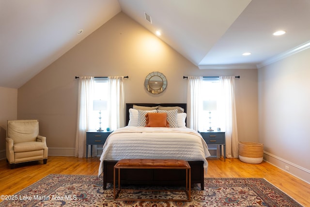 bedroom with recessed lighting, visible vents, wood finished floors, and lofted ceiling