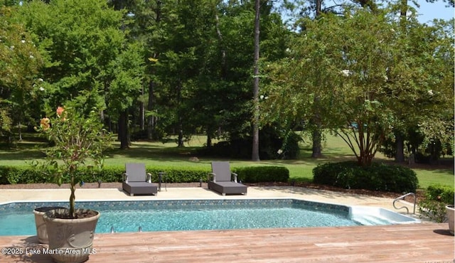 outdoor pool featuring a wooden deck
