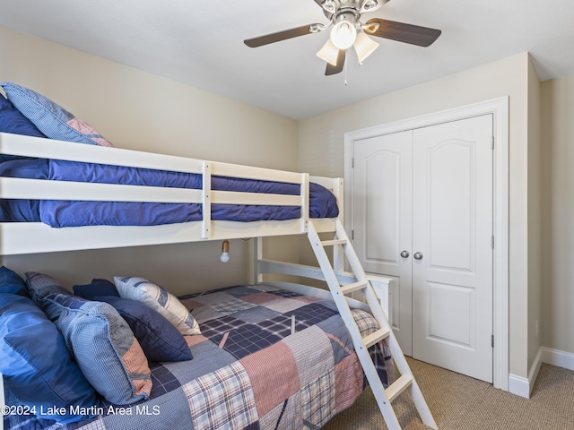 bedroom with carpet flooring, a closet, and ceiling fan