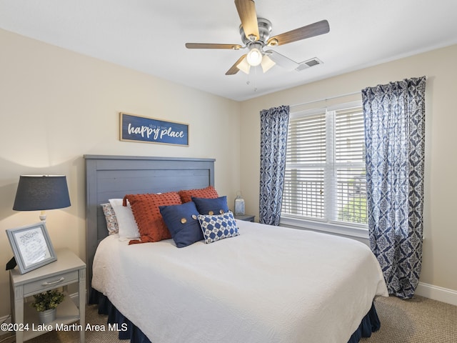 carpeted bedroom with ceiling fan