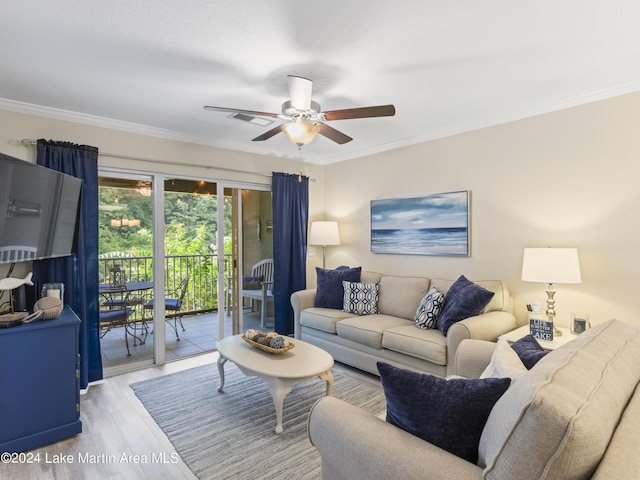 living room with ceiling fan, ornamental molding, and hardwood / wood-style flooring