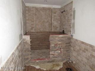 1415 Lee Road 219, Phenix City, AL 36870 - full bathroom featuring tiled shower and crown molding