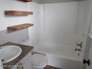 1415 Lee Road 219, Phenix City, AL 36870 - bathroom featuring shower / bath combination and vanity
