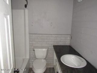 1415 Lee Road 219, Phenix City, AL 36870 - full bathroom featuring vanity and tile walls