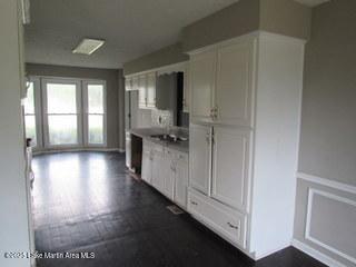 1415 Lee Road 219, Phenix City, AL 36870 - kitchen with white cabinetry and light countertops