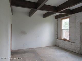 1415 Lee Road 219, Phenix City, AL 36870 - unfurnished room with beam ceiling