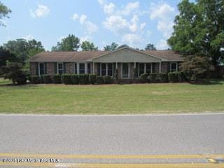 1415 Lee Road 219, Phenix City, AL 36870 - ranch-style home with a front lawn