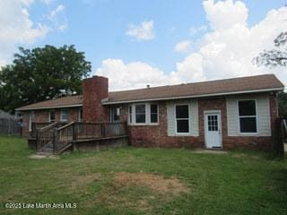 1415 Lee Road 219, Phenix City, AL 36870 - rear view of house featuring a yard, a wooden deck, and brick siding