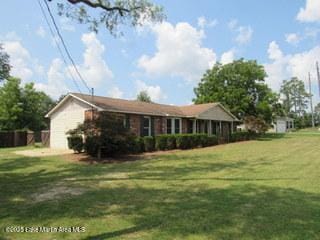 1415 Lee Road 219, Phenix City, AL 36870 - back of house featuring a yard