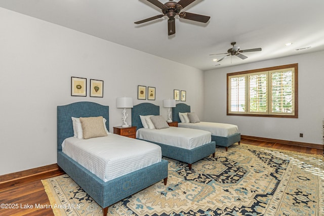 bedroom featuring dark hardwood / wood-style floors and ceiling fan