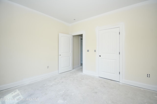 63 Noles Dr, Tallassee, AL 36078 - unfurnished bedroom featuring unfinished concrete floors and baseboards
