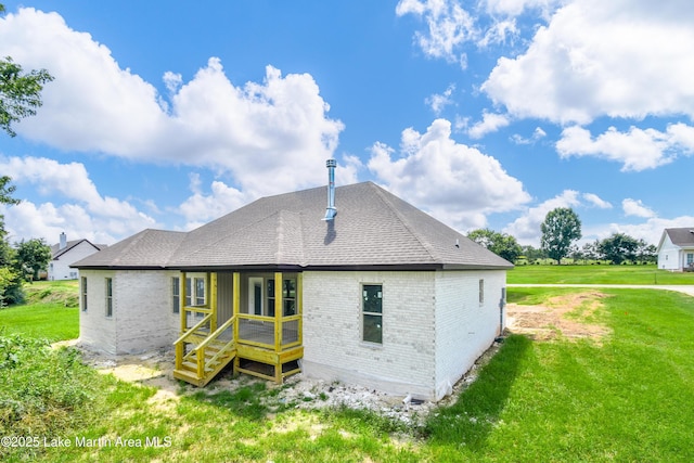 63 Noles Dr, Tallassee, AL 36078 - rear view of property with brick siding and a yard