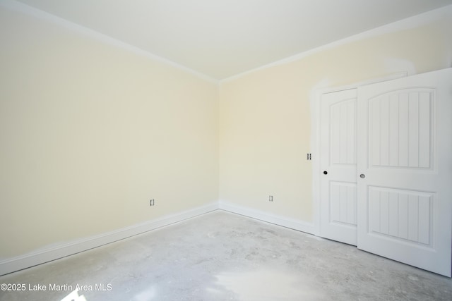63 Noles Dr, Tallassee, AL 36078 - unfurnished bedroom featuring concrete floors and a closet