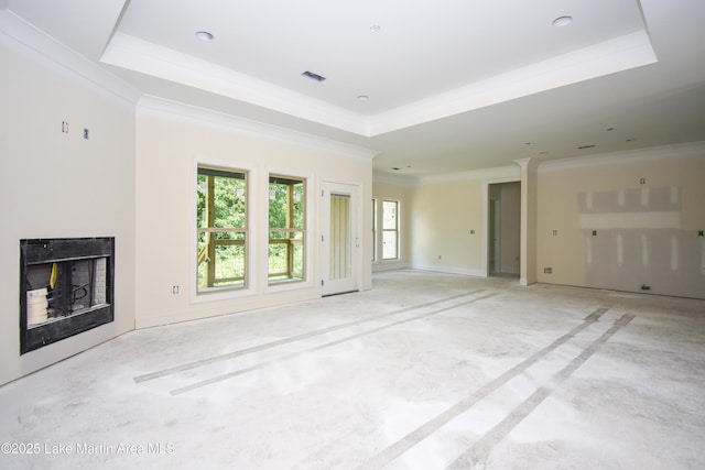 63 Noles Dr, Tallassee, AL 36078 - unfurnished living room with a tray ceiling, crown molding, and a fireplace