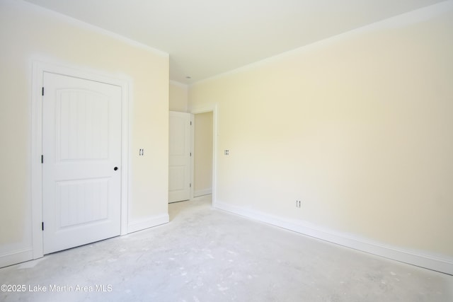 63 Noles Dr, Tallassee, AL 36078 - unfurnished bedroom featuring unfinished concrete floors and baseboards